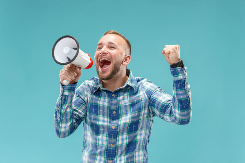man-making-announcement-with-megaphone